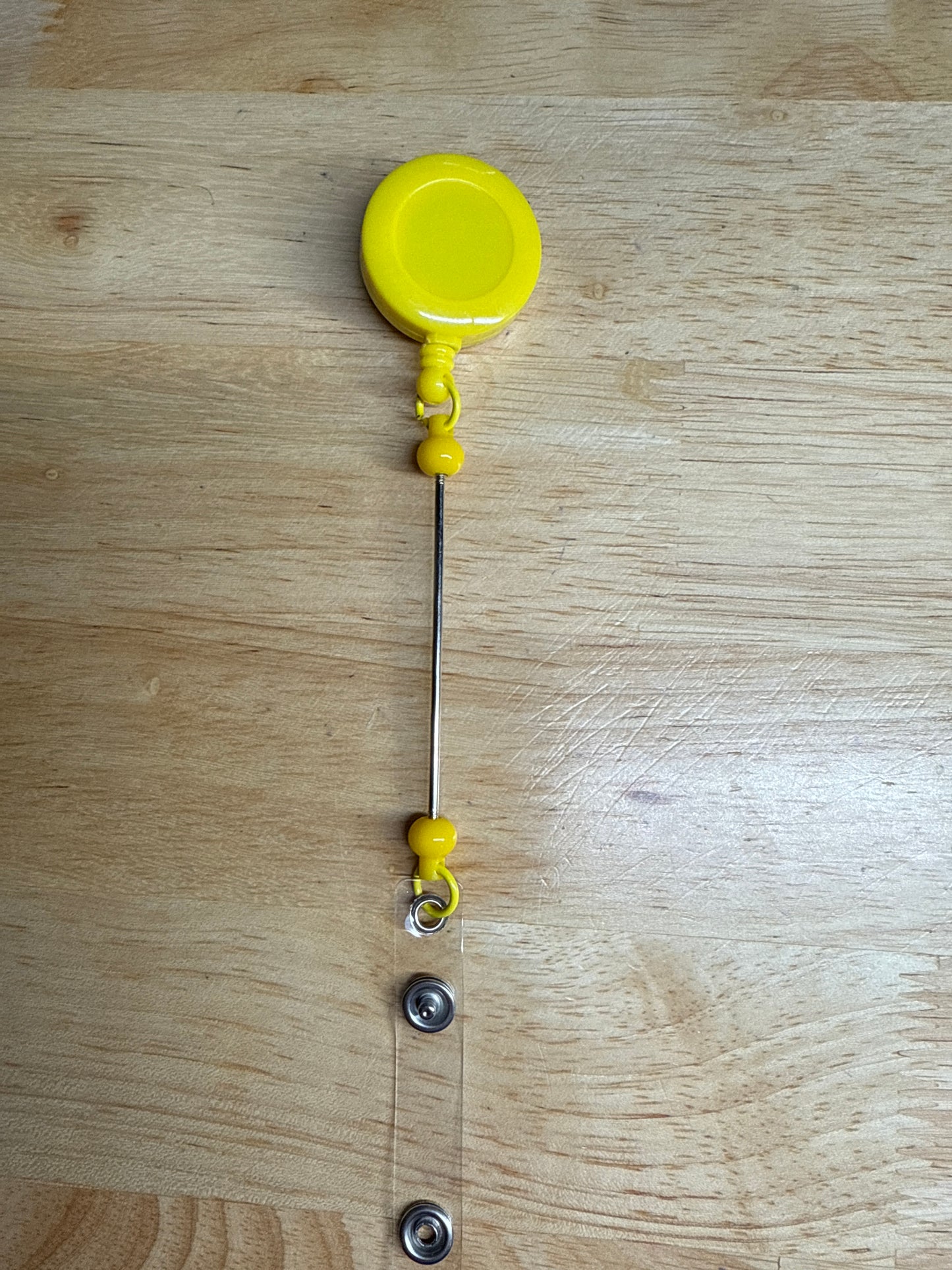 Carretes de insignia con barra de cuentas extendida