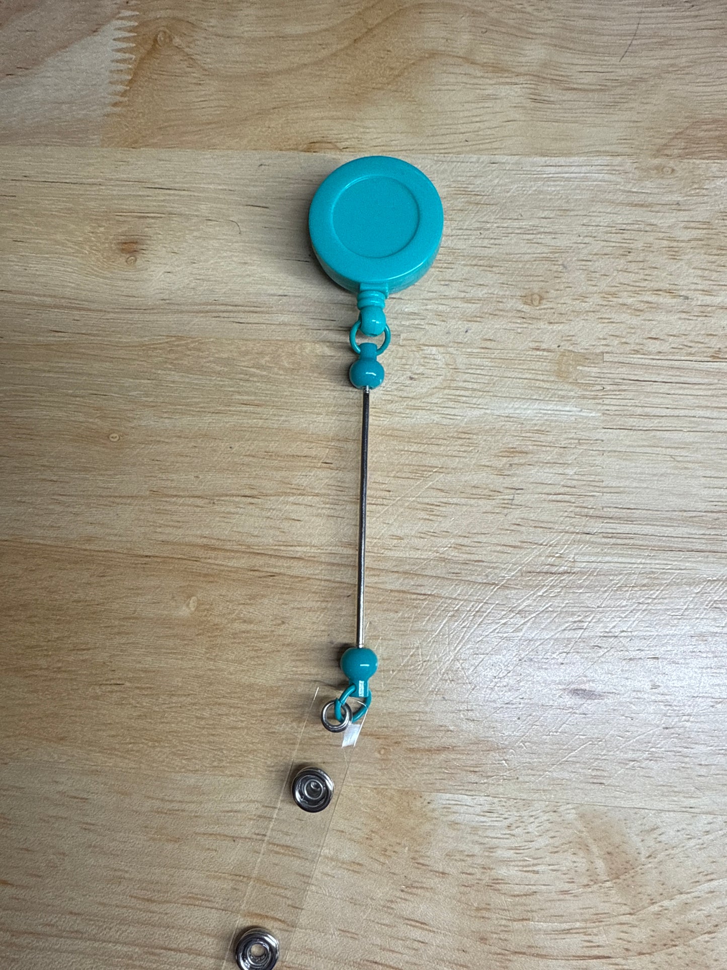 Carretes de insignia con barra de cuentas extendida
