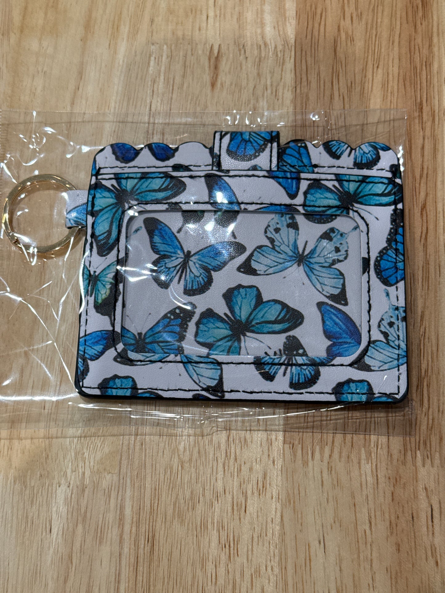 Monedero con diseño de mariposa azul y herrajes dorados