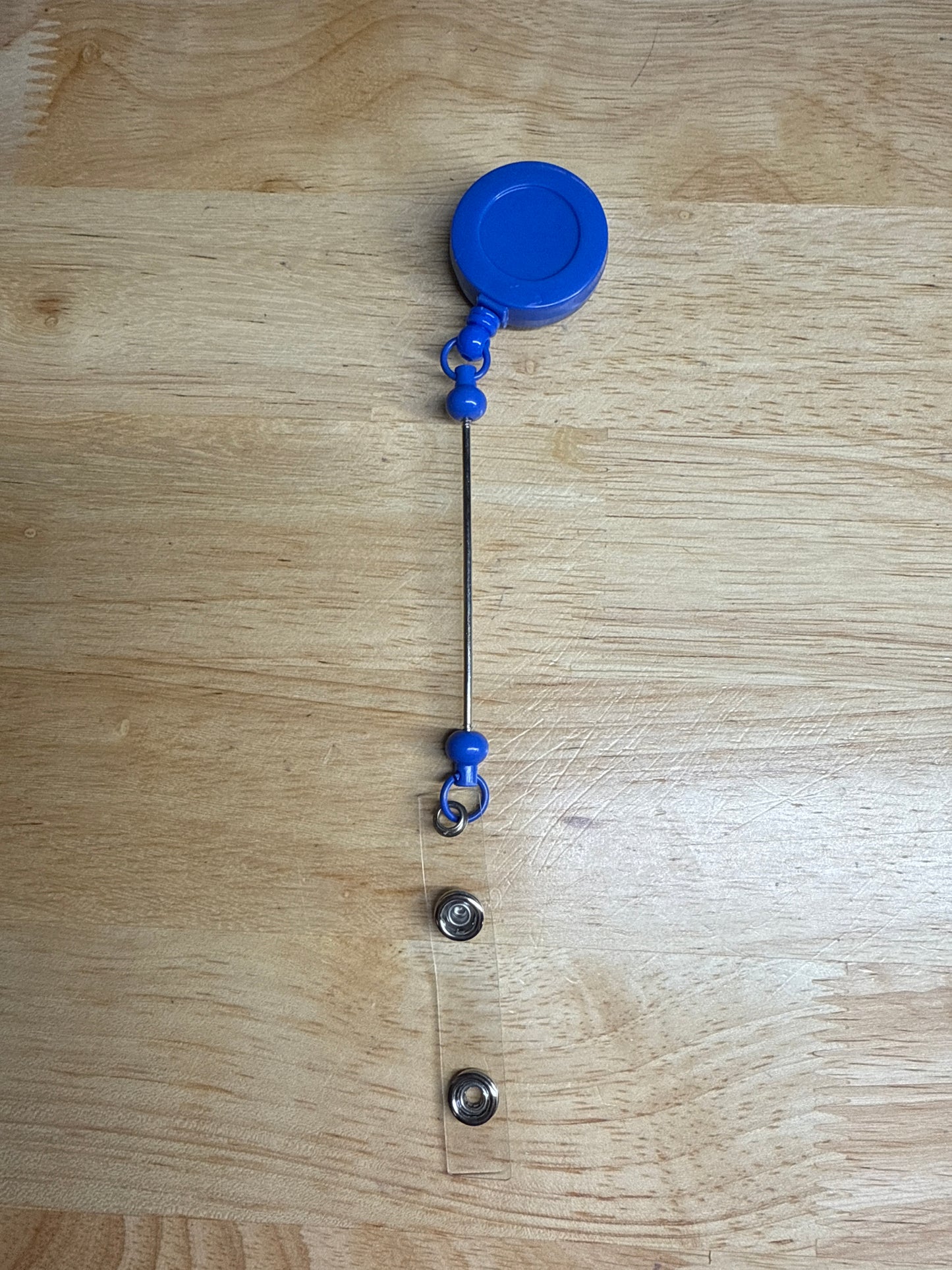 Carretes de insignia con barra de cuentas extendida