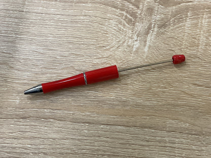 Bolígrafo de plástico con cuentas de colores sólidos
