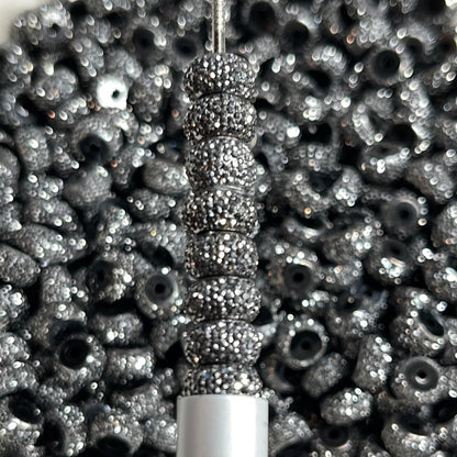 Paquete de 10 cuentas espaciadoras brillantes de plata negra de 12 mm